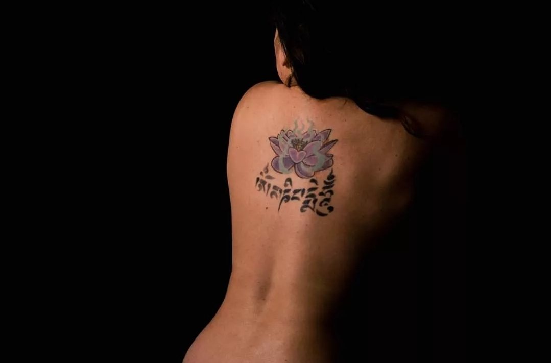 Self-portrait — lotus and Sanskrit